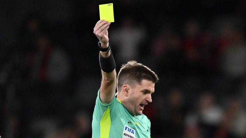 Two men have been charged after allegedly manipulating yellow card calls in the A-League.
