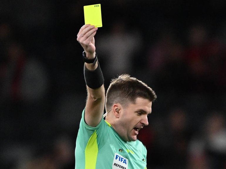 Two men have been charged after allegedly manipulating yellow card calls in the A-League. 