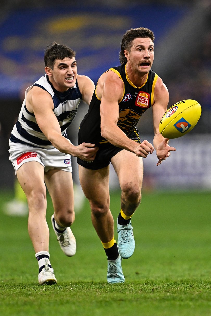 PERTH, AUSTRALIA - JUNE 01: Liam Baker of the Eagles handpasses the ball during the 2025 AFL Round 12 match between the West Coast Eagles and the Geelong Cats at Optus Stadium on June 1, 2025 in Perth, Australia. (Photo by Daniel Carson/AFL Photos)