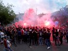 PARIS, FRANCE - MAY 31: Fans of Paris Saint-Germain outside the stadium light red flares in celebration after Achraf Hakimi of Paris Saint-Germain (not pictured) scores his team's first goal during the UEFA Champions League Final 2025 between Paris Saint-Germain and FC Internazionale Milano at Munich Football Arena on May 31, 2025 in Paris, France. Paris Saint-Germain play FC Internazionale Milano in the final being held in Munich. (Photo by Julian Finney/Getty Images)