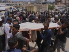 Palestinians have held funerals for people shot while heading to a Gaza aid hub for food. 