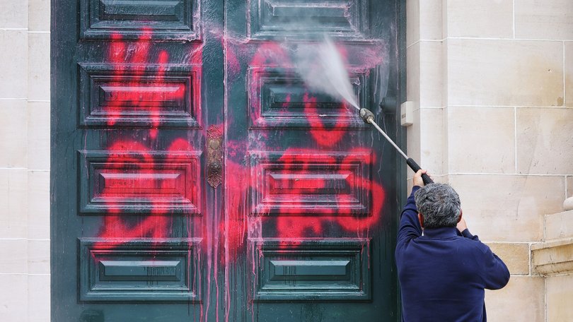 News. Graffiti on front doors of Parliament House in West Perth.