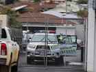 Police are investigating the discovery of a man's body in a bin at the rear of a business in Hobart. 