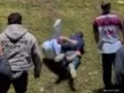 Fans engaged in the Run It Straight trend at an NRL game.