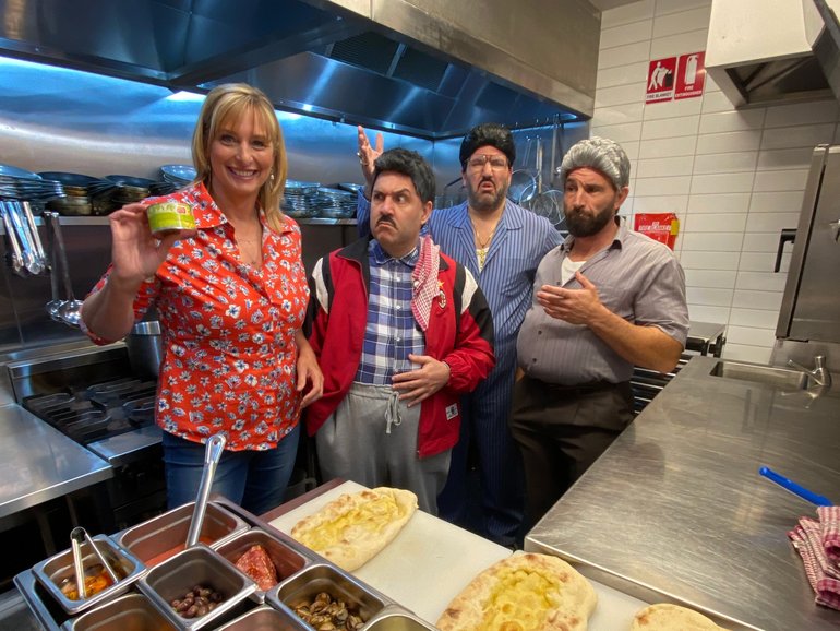 Johanna Griggs with the dads in the kitchen.  