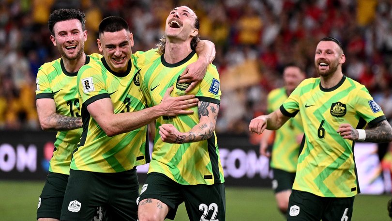 Jackson Irvine of the Socceroos (centre) celebrates with teammates after scoring a goal during the 2026 FIFA men's World Cup qualifier match between Australia and Indonesia at Allianz Stadium in March.