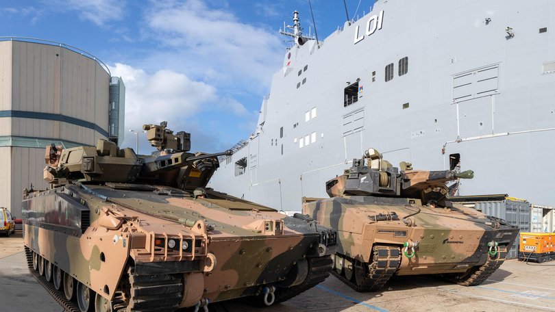 Australian Army Infantry Fighting Vehicles, Hanwha Defense Australia Redback (left) and the Rheinmetall Defence Australia KF-41 Lynx, stand ready to board HMAS Adelaide at HMAS Kuttabul, NSW.