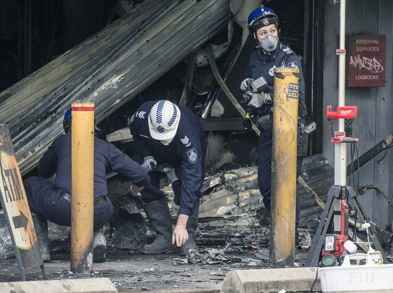 Investigators at a Browns Plains Tobacconists in Brisbane as two men were seriously injured after a tobacco shop was set alight in what police say is a suspicious fire last week.
Picture: NewsWire/ Glenn Campbell