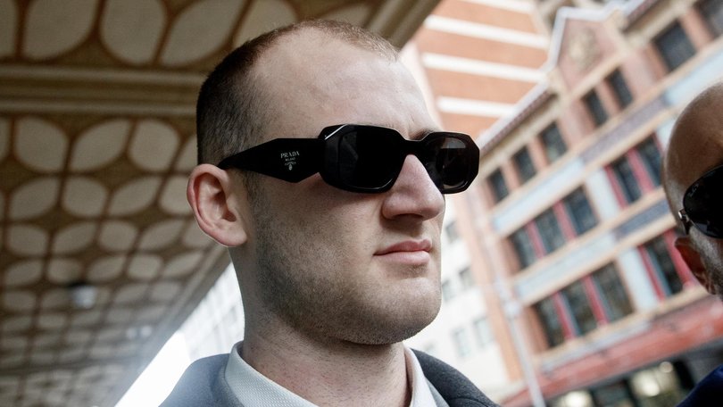 Ethan Davis leaves the Downing Centre Court on Wednesday.