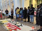 Hundreds have gathered outside NT Parliament, lighting candles and calling for an independent investigation after Kumanjayi White died in police custody. (Lloyd Jones/AAP PHOTOS)