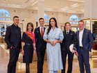 David Jones chief executive Scott Fyfe, left, with Megan Gale, centre, Qantas crew and Qantas Loyalty boss Andrew Glance, right.