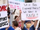 Nurses have donned pink in one state to voice their pay concerns and warn that work bans could be next. 