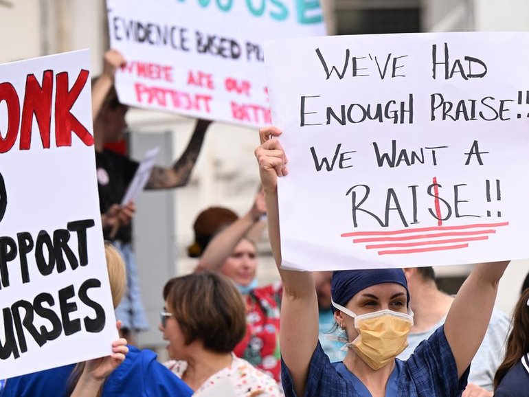Nurses have donned pink in one state to voice their pay concerns and warn that work bans could be next. 