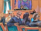  Sean "Diddy" Combs sits with his legal team.