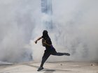 Protesters and federal police have clashed after immigration agents conducted sweeping raids. (AP PHOTO)