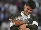 Carlos Alcaraz hugs the French Open trophy after winning his fifth slam in amazing fashion in Paris. (AP PHOTO)