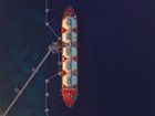 High angle view of an LNG Tanker moored to the jetty to supply Liquified Natural Gas to the Power Station.