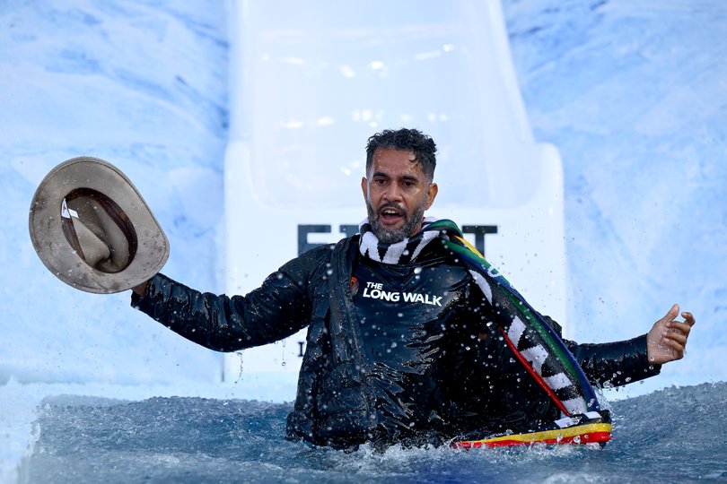 Former AFL player Aaron Davey goes down the slide for FightMND Big Freeze 11.