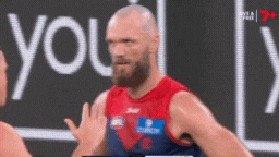 Max Gawn shoves Steven May away after the final siren. 