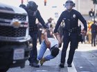 A protester is detained in downtown Los Angeles.