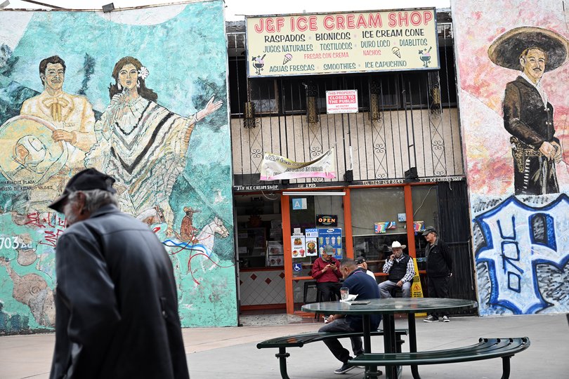 People gather at Mariachi Plaza in Los Angeles's Boyle Heights neighborhood on June 9. MUST CREDIT: Joshua Lott/The Washington Post