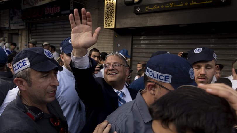 Israeli National Security Minister Itamar Ben Gvir greets supporters in the Jerusalem Day Flag March.