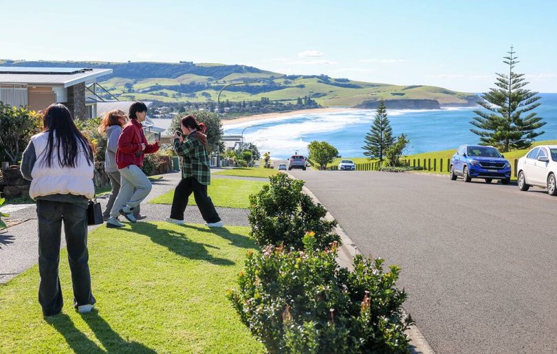 Tourists filming and photographing themselves on Tasman Drive, Gerringong. Picture: Adam McLean
