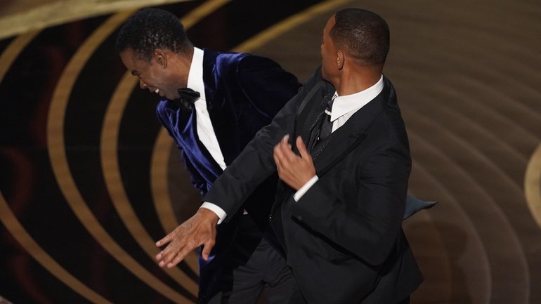 Will Smith slapping Chris Rock at the 2022 Oscars.