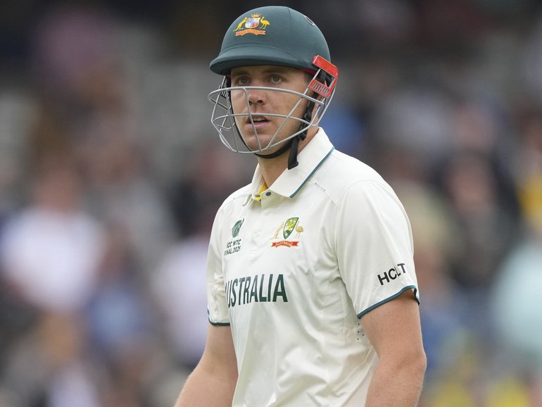 Australia's Cameron Green walks off the field after losing his wicket.