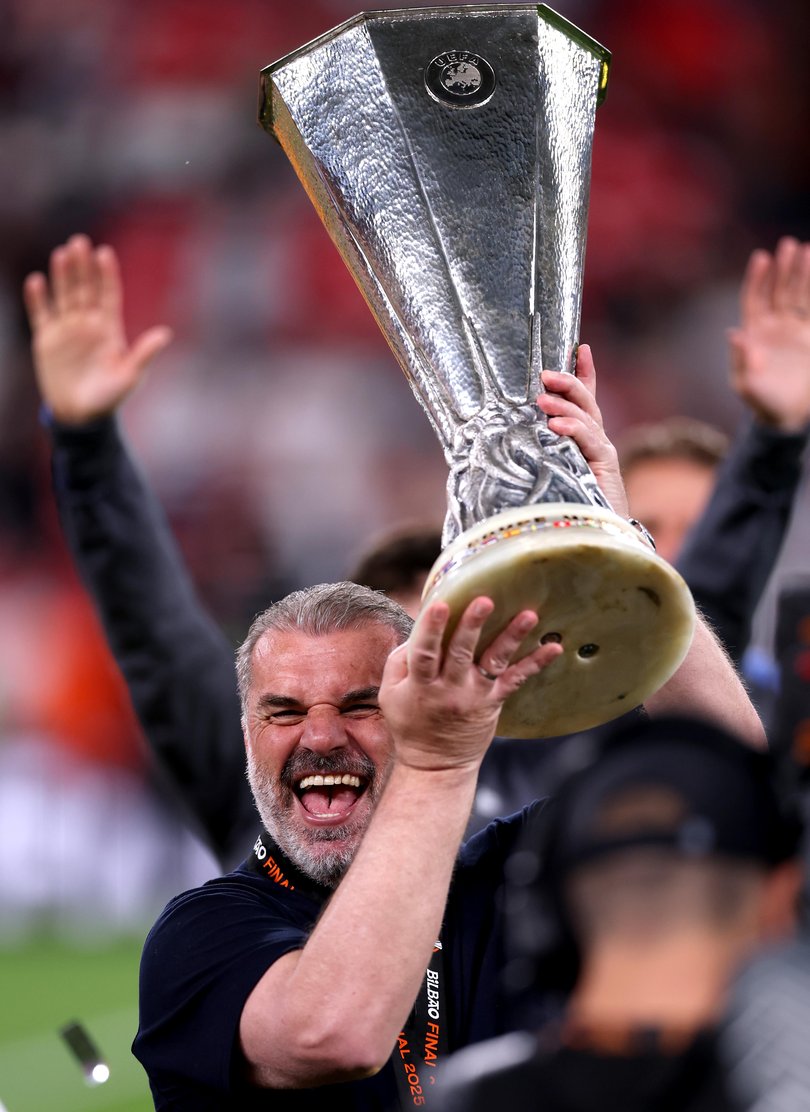 Ange Postecoglou shows off the Europa trophy.