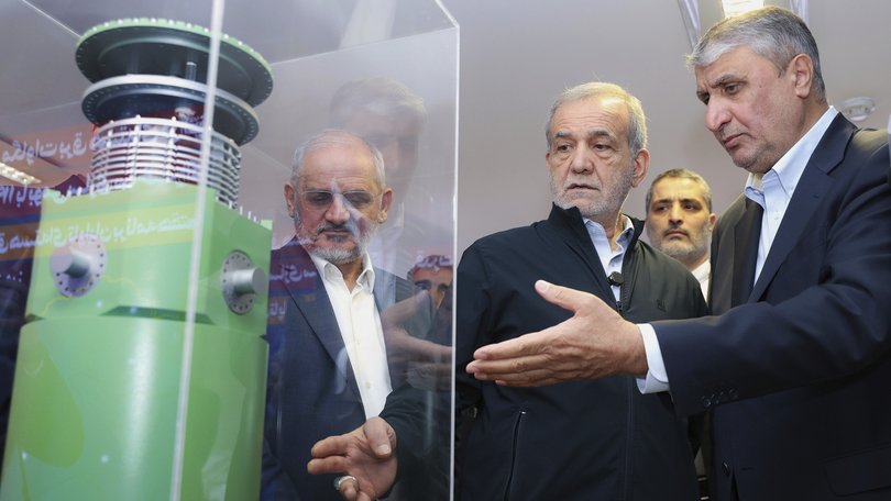 President Masoud Pezeshkian, second right, listens to Head of the Atomic Energy Organization of Iran Mohammad Eslami as he visits an exhibition of Iran's nuclear achievements in Tehran in April. (Iranian Presidency Office via AP)