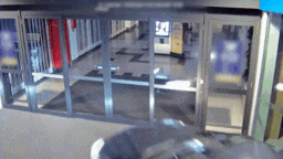 CCTV footage shows the car smashing through two glass doors and driving inside the shopping centre, causing significant damage.