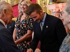 A day before being given the honour, David Beckham chatted with the King at a palace ceremony. (AP PHOTO)