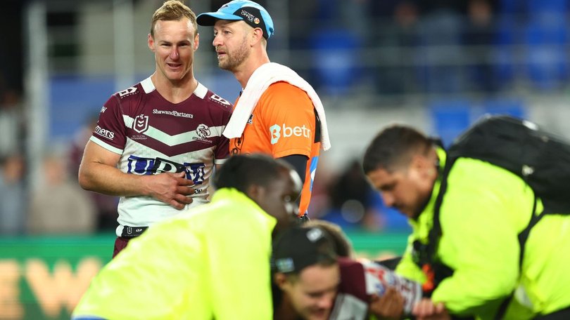 DCE watches on as security deal with the pitch-invader.