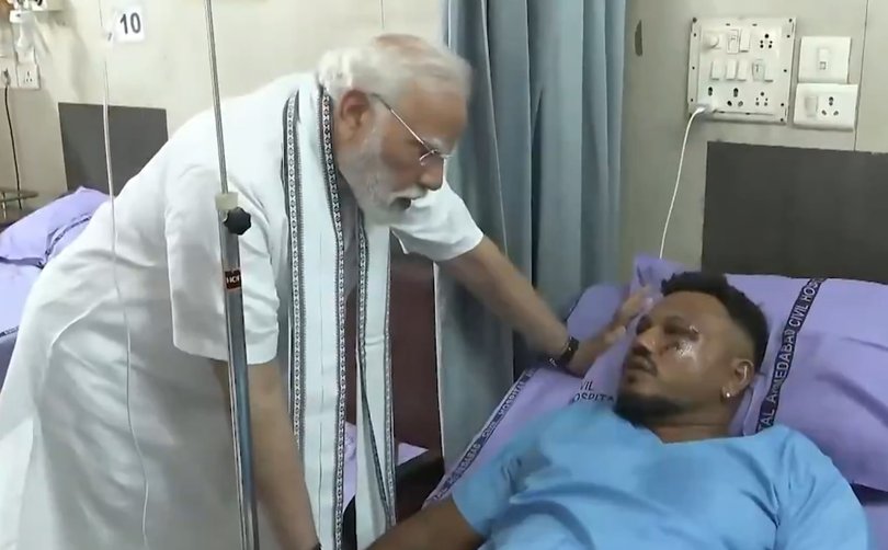 PM Narendra Modi meets crash survivor Vishwaskumar Ramesh.