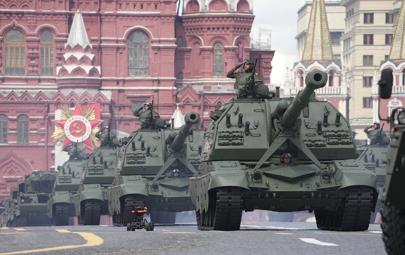 Russian self-propelled artillery vehicles roll during the Victory Day military parade in Moscow in 2022.