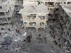 Emergency and rescue soldiers search for trapped people around heavily damaged buildings after an overnight missile strike from Iran in Bat Yam Israel.
