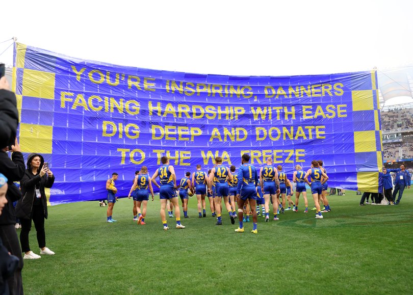West Coast walk through the banner.