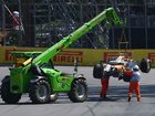 Marshals remove the car of Lando Norris of Great Britain and McLaren from the circuit during the F1 Grand Prix of Canada.