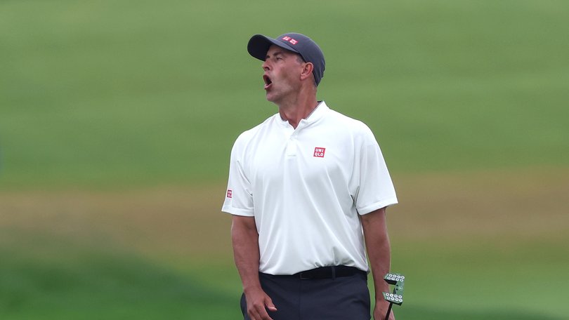 Adam Scott of Australia reacts to a missed birdie putt on the 15th green during the final round of the 125th U.S. Open.