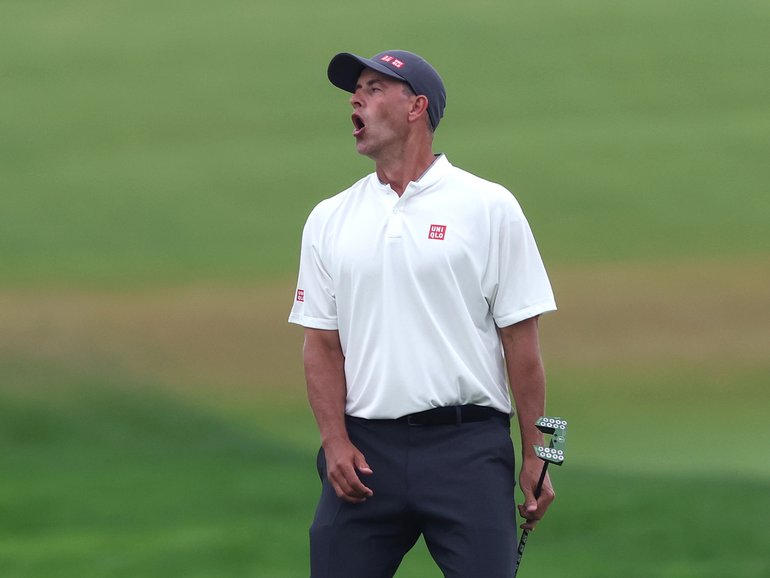 Adam Scott of Australia reacts to a missed birdie putt on the 15th green during the final round of the 125th U.S. Open.