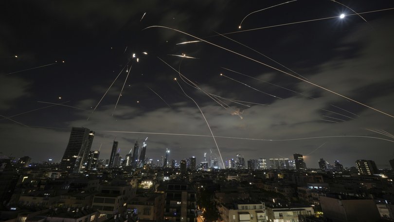The Israeli Iron Dome air defence system fires to intercept missiles during an Iranian attack over Tel Aviv, Israel, Sunday, June 15, 2025.