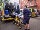 Paramedics found a woman dead in her apartment more than seven hours after she called triple zero.