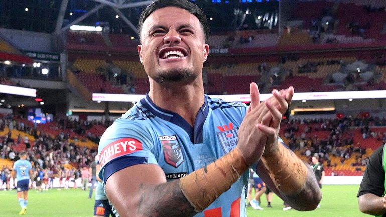 Spencer Leniu celebrates victory after game one of the  State of Origin series.