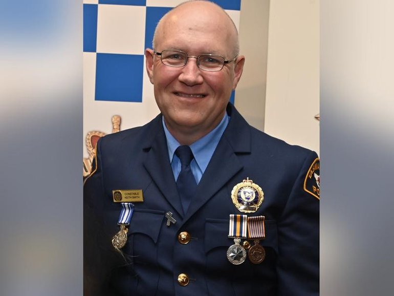 Constable Keith Anthony Smith was killed while delivering a home repossession order.  (Tasmania Police/AAP PHOTOS)