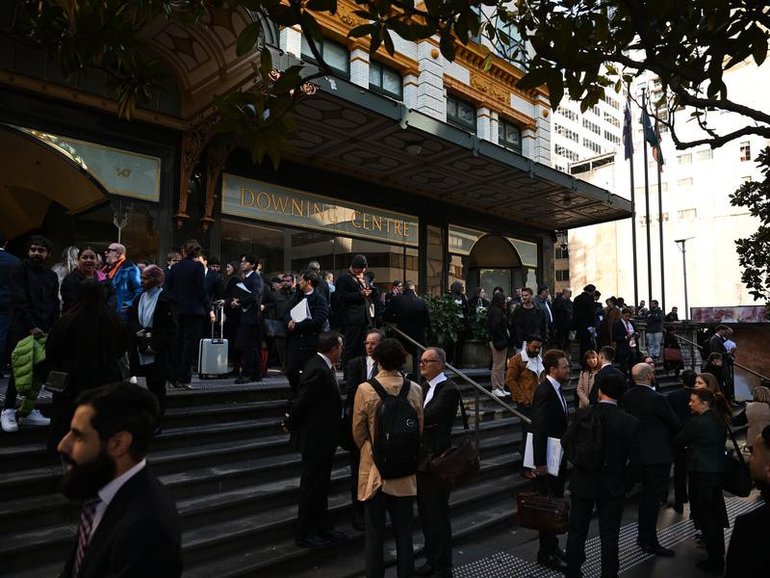 A power outage, caused by a burst pipe, forced the evacuation of a busy city courthouse. (Dean Lewins/AAP PHOTOS)