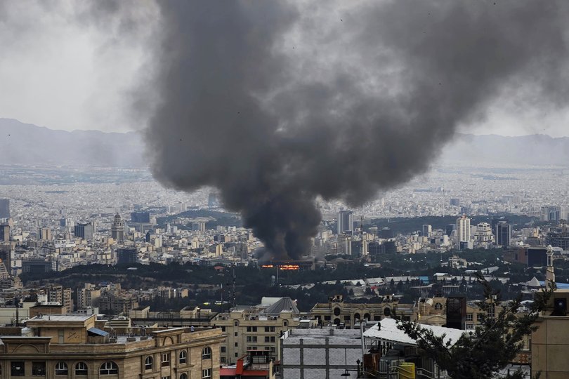 Smoke rises after an Israeli strike on a building used by the Islamic Republic of Iran News Network.
