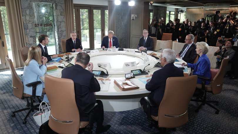 L-R Clockwise) Japan's Prime Minister Shigeru Ishiba, Italy's Prime Minister Giorgia Meloni, French President Emmanuel Macron, Canadian Prime Minister Mark Carney, US President Donald Trump, British Prime Minister Keir Starmer, German Chancellor Friedrich Merz, European Commission President Ursula Von der Leyen, and European Council President António Costa attend a working session during the G7 Leaders Summit on June 15, 2025 in Kananaskis, Canada.