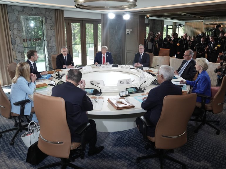 L-R Clockwise) Japan's Prime Minister Shigeru Ishiba, Italy's Prime Minister Giorgia Meloni, French President Emmanuel Macron, Canadian Prime Minister Mark Carney, US President Donald Trump, British Prime Minister Keir Starmer, German Chancellor Friedrich Merz, European Commission President Ursula Von der Leyen, and European Council President António Costa attend a working session during the G7 Leaders Summit on June 15, 2025 in Kananaskis, Canada.