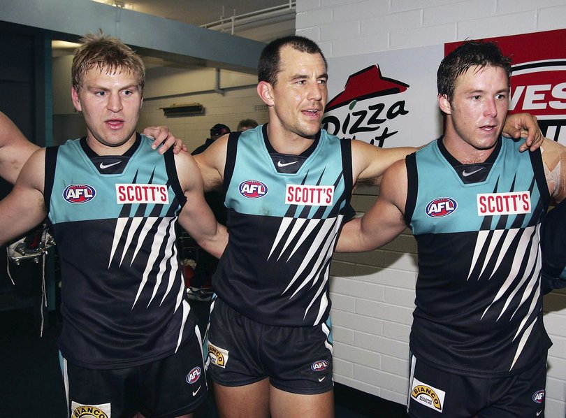 Kane Cornes (left) and Warren Tredrea (middle) were teammates at Port Adelaide.